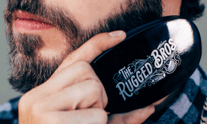 man-brushing-his-beard